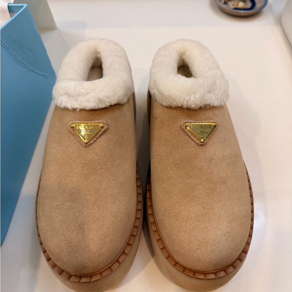 Prada Beige Shearling Slippers with Gold Logo